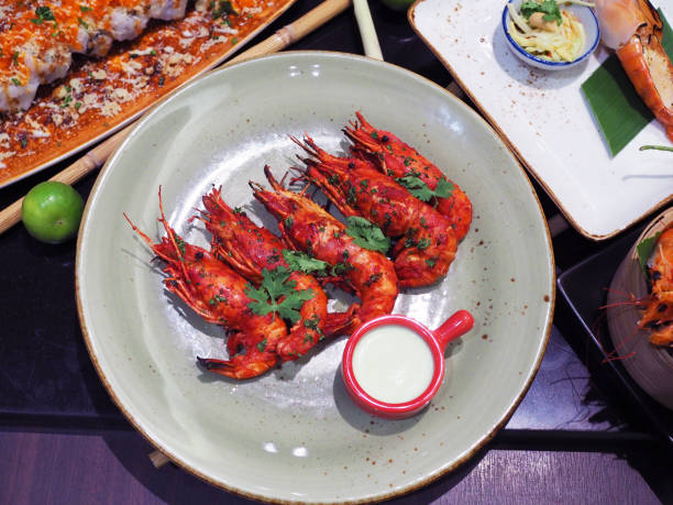 istock Fried River Prawn served with white sauce. Traditional food. 958697986