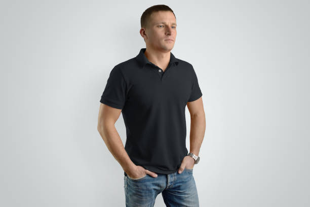 istock Front Mockup  black polo shirt on a guy for an example design. 958698580