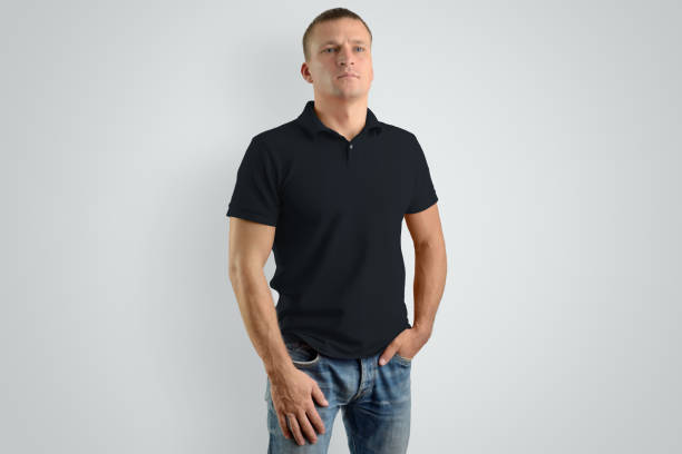 istock Front mockup black  polo shirt on a strong man isolated on a gray background. 958698656