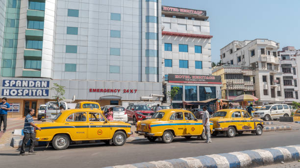 Taxi Stand March 03,2018. Kolkata, West Bengal, India. Yellow taxi stand in front of a Private Hospital. india hospital stock pictures, royalty-free photos & images