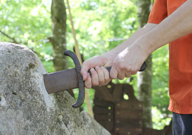istock boy takes the excalibur sword 958701340