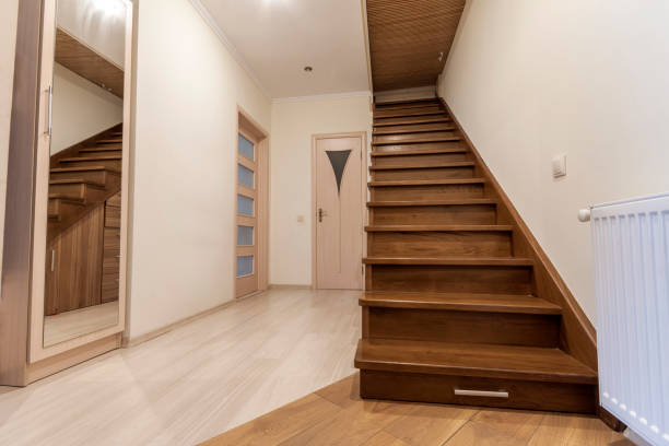istock Modern architecture interior with elegant luxury hallway with glossy wooden staps stairs in modern storey house 958702460