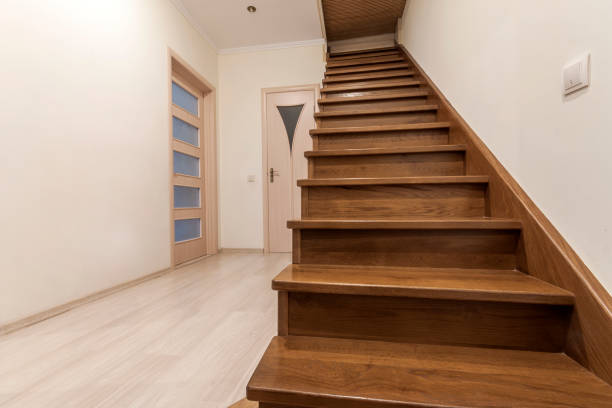 istock Modern architecture interior with elegant luxury hallway with glossy wooden staps stairs in modern storey house 958702578