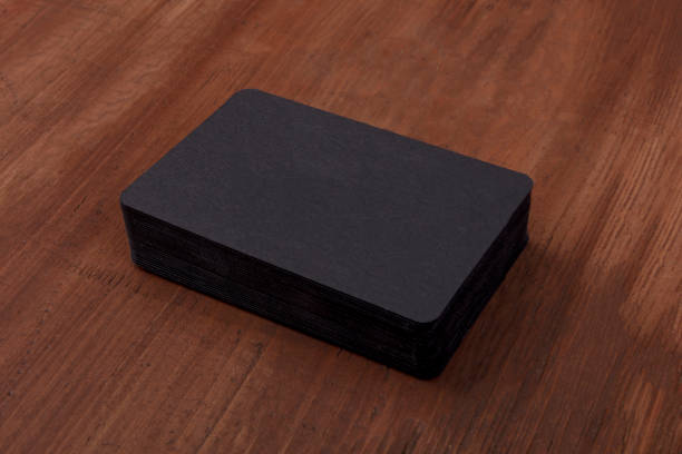 istock Black business cards mockup on a rustic background 958704348