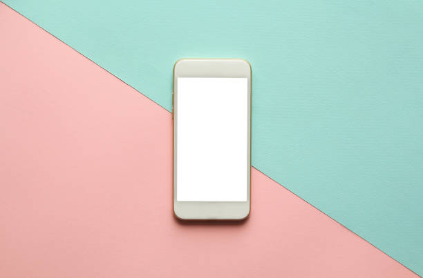 Blank screen white cellphoneon diagonal pastel pink and blue background.