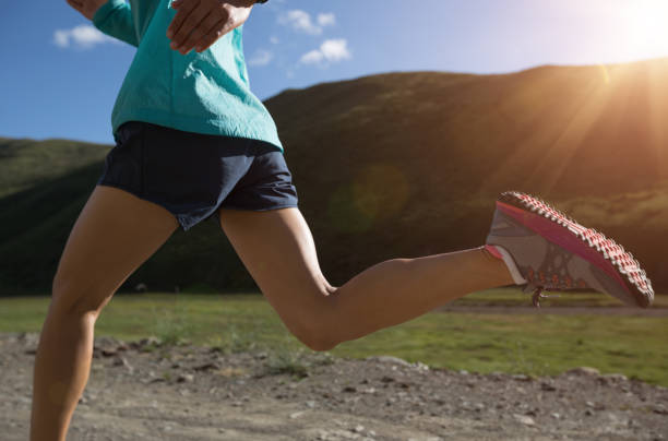 istock Young woman running on trail 958707538