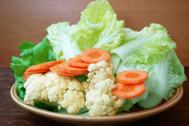 Vegetable set: green sweet basil ( Thai basil ), Celery (Smallage), morning glory, cauliflower, Chinese cabbages and orange carrots