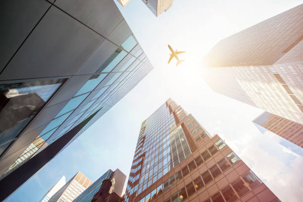 istock Airplane Flying Over Skyscrapers in New York 958707976