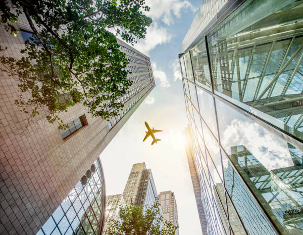 istock Airplane Flying Over Skyscrapers in New York 958708026