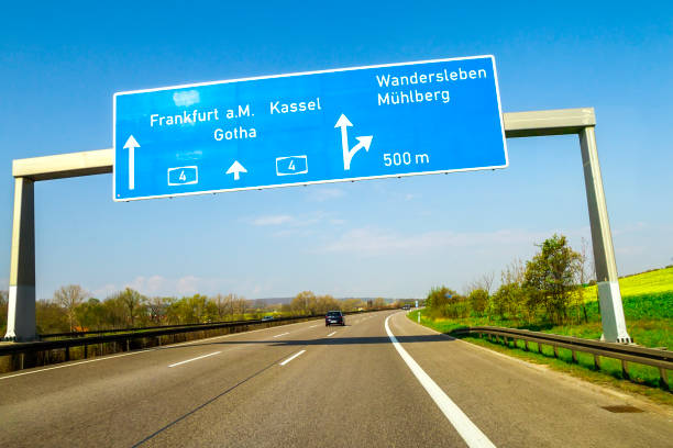 istock Blue freeway sign over the road in Germany on sunny day 958708650