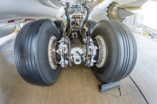 istock Wheels rubber tire rear landing gear racks, under wing view. 958709042
