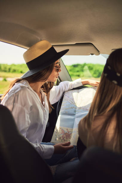 istock Two young women having fun on road trip 958709268