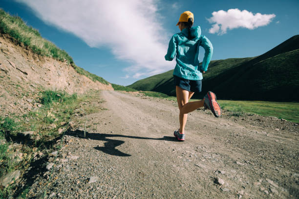 istock Young woman running on trail 958709816