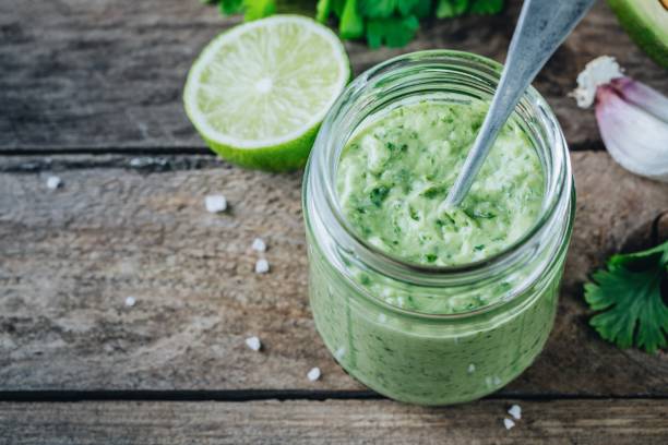 istock green salad dressing with avocado, lime and cilantro in a glass jar 958712792