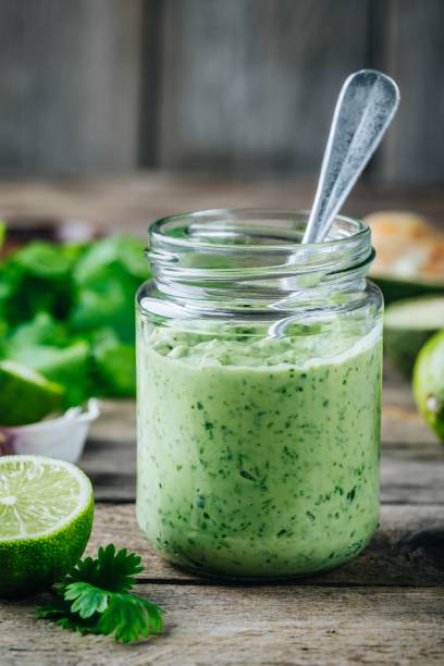 istock green salad dressing with avocado, lime and cilantro in a glass jar 958712902