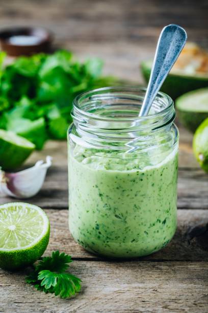 istock green salad dressing with avocado, lime and cilantro in a glass jar 958713088
