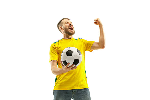 istock Brazilian fan celebrating on white background 958713456