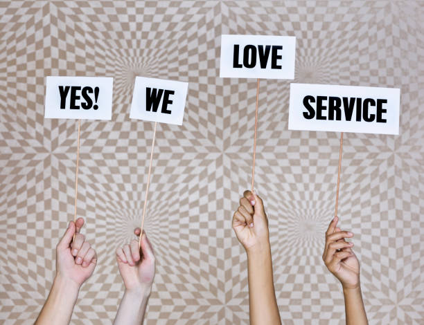 istock Four hands hold up sign: 