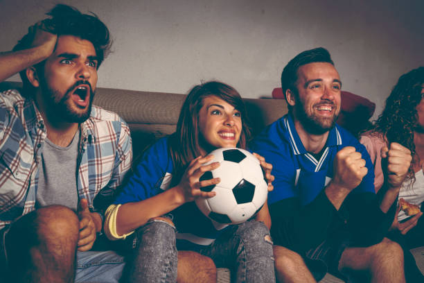 istock Friends watching football 958713964