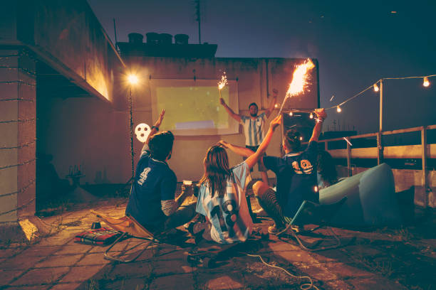 istock Football fans cheering for their team 958714148