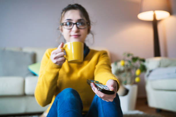 istock Young woman at home chatting with friends 958714392