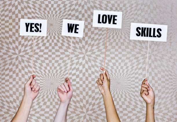 istock Four hands hold up sign: 