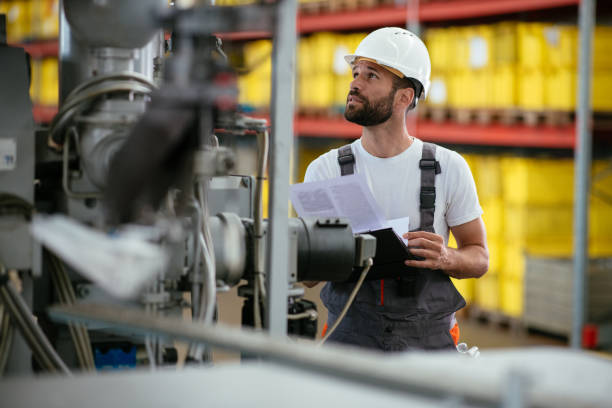 istock Male manual worker in factory 958718626