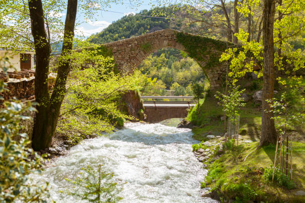 Great amount of water in Castellar de n'Hug during springtime snow melting moment. The village where the Llobregat River is born.