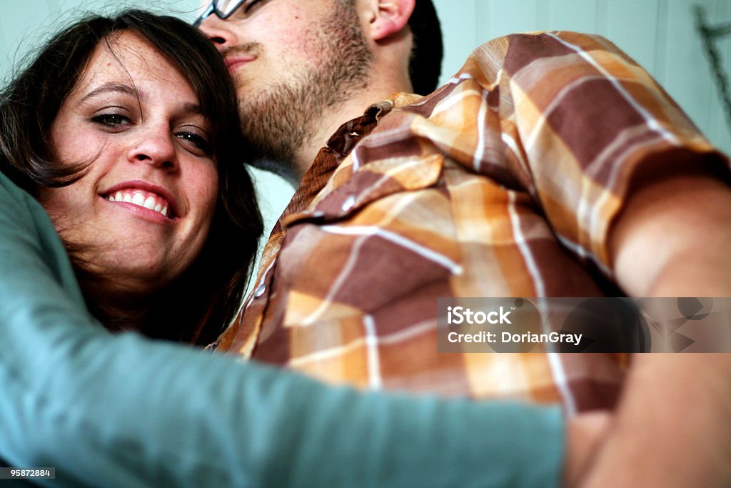 couple affection 2 young couple holding eachother looking very happy and peaceful, shot from below Adult Stock Photo