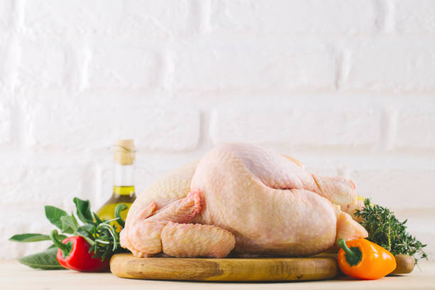 istock Ingredients for cooking on kitchen table with chicken and vegetables 958730474