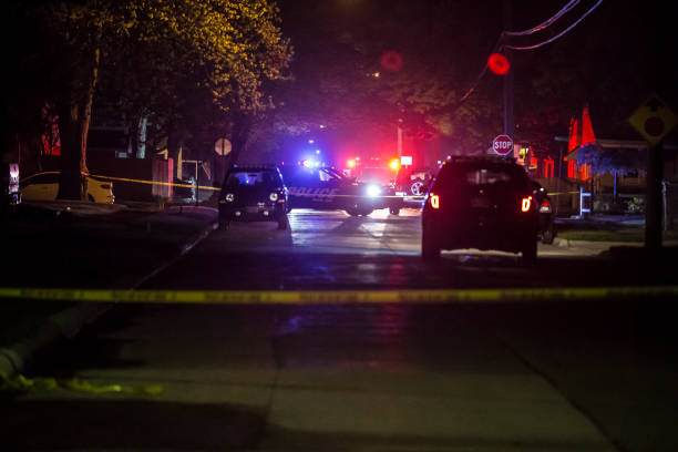 The scene of a Police shooting in Royal Oak, MI May 14th 2018 (2018-05-14 Royal Oak, MI) Officers on the scene of a shooting near the intersection of Hudson Ave and McLean Ave in Royal Oak just after 3:13am Monday May 14th 2018. crime scene stock pictures, royalty-free photos & images