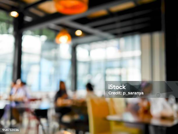 Blurred People Dinning In The Restaurant Stock Photo - Download Image Now - Defocused, Dining, Friendship