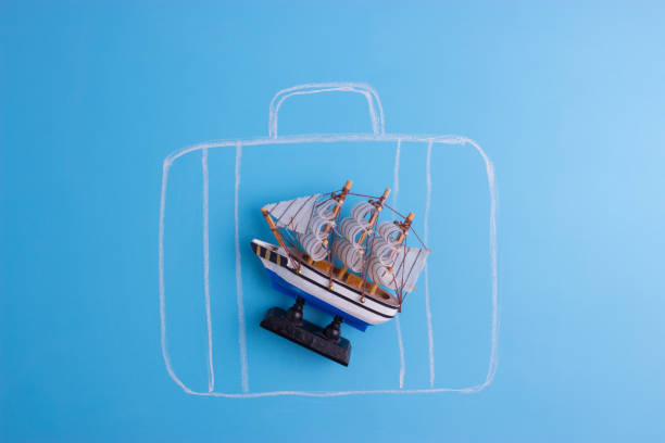 istock sketch of a suitcase on blue background 958732068