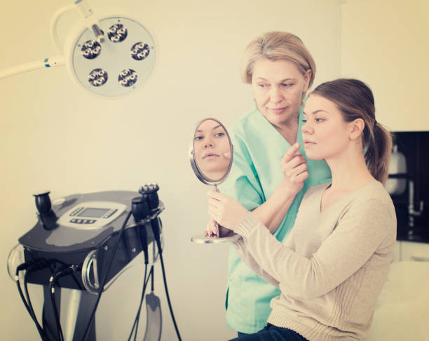 istock Beautician discussing treatment with girl 958732642