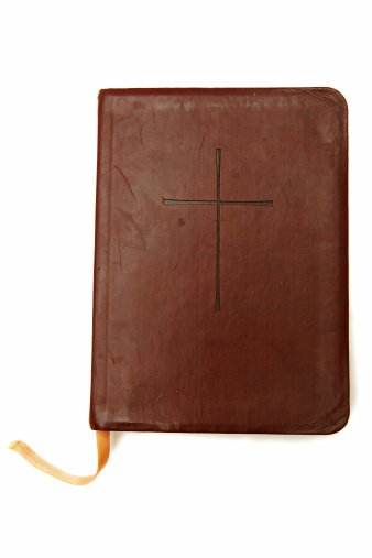 leather bible with cross on front, isolated