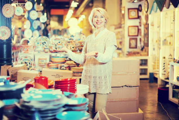 istock Positive  mature woman standing  at ceramic section 958735776
