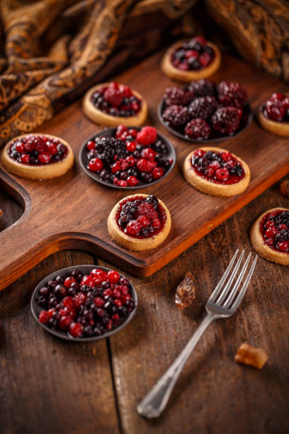 istock Delicious berry fruits mini tarts 958736102