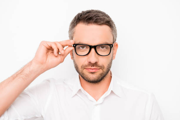 istock Attractive smart successful man touching his eyewear 958737848