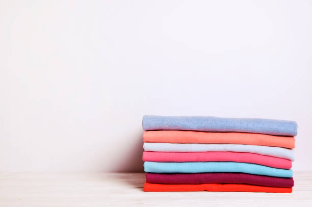 istock Composition with folded clothes, unisex for both man and woman, different color & material. Pile of laundry, dry clean clothing 958738874