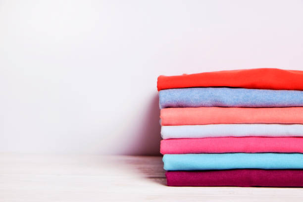 istock Composition with folded clothes, unisex for both man and woman, different color & material. Pile of laundry, dry clean clothing 958738876