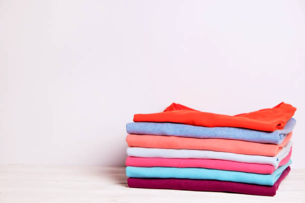 istock Composition with folded clothes, unisex for both man and woman, different color & material. Pile of laundry, dry clean clothing 958738878