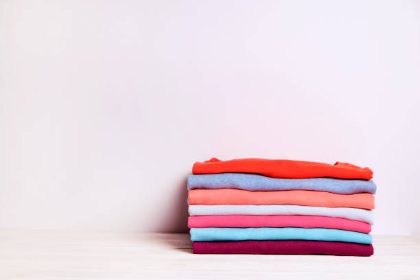 istock Composition with folded clothes, unisex for both man and woman, different color & material. Pile of laundry, dry clean clothing 958738888