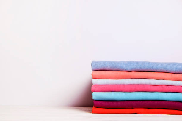 istock Composition with folded clothes, unisex for both man and woman, different color & material. Pile of laundry, dry clean clothing 958738892