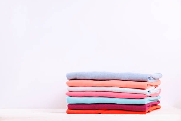 istock Composition with folded clothes, unisex for both man and woman, different color & material. Pile of laundry, dry clean clothing 958738964