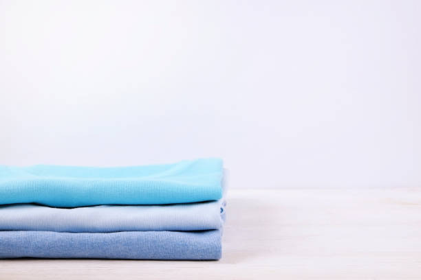 istock Composition with folded clothes, unisex for both man and woman, different color & material. Pile of laundry, dry clean clothing 958739040