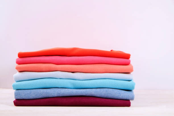 istock Composition with folded clothes, unisex for both man and woman, different color & material. Pile of laundry, dry clean clothing 958739116