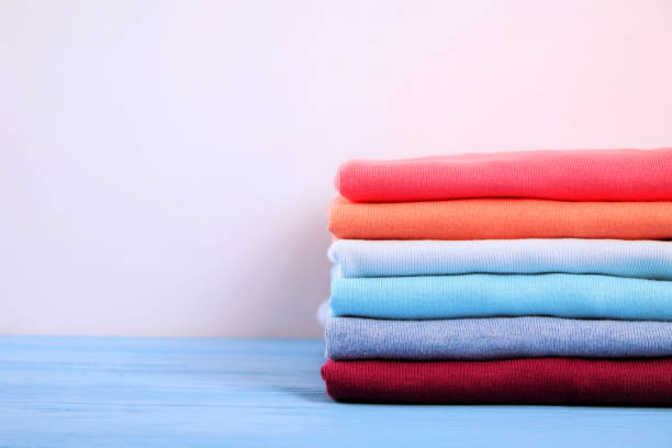 istock Composition with folded clothes, unisex for both man and woman, different color & material. Pile of laundry, dry clean clothing 958739200