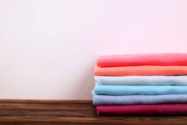 istock Composition with folded clothes, unisex for both man and woman, different color & material. Pile of laundry, dry clean clothing 958739210