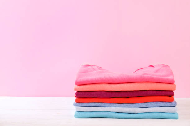 istock Composition with folded clothes, unisex for both man and woman, different color & material. Pile of laundry, dry clean clothing 958739260