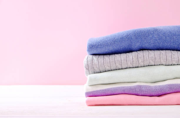 istock Composition with folded clothes, unisex for both man and woman, different color & material. Pile of laundry, dry clean clothing 958740408